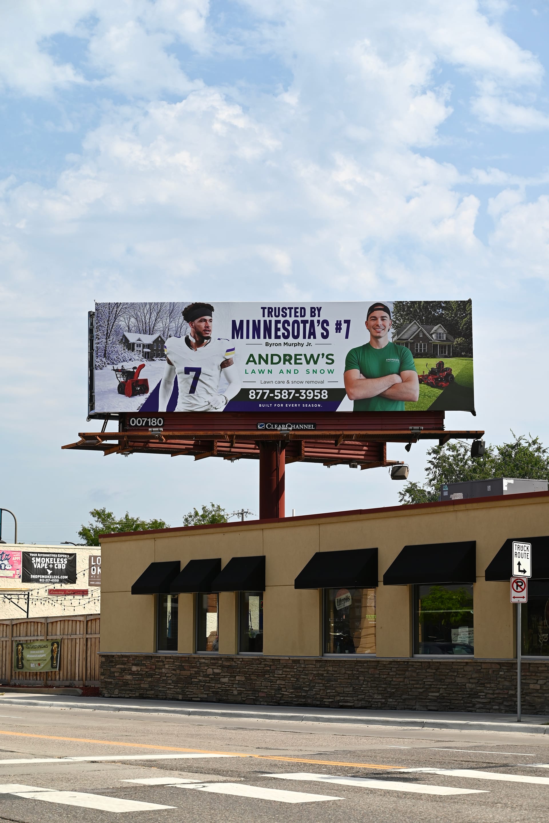 Andrew's Lawn and Snow billboard at Central Avenue and 5th Street